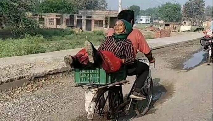 मां यशोदा को फल की टोकरी में बैठाकर नेपाल जा रहा ये शख्स, देखने वाले बोले-कोरोना काल का है 'श्रवण कुमार'