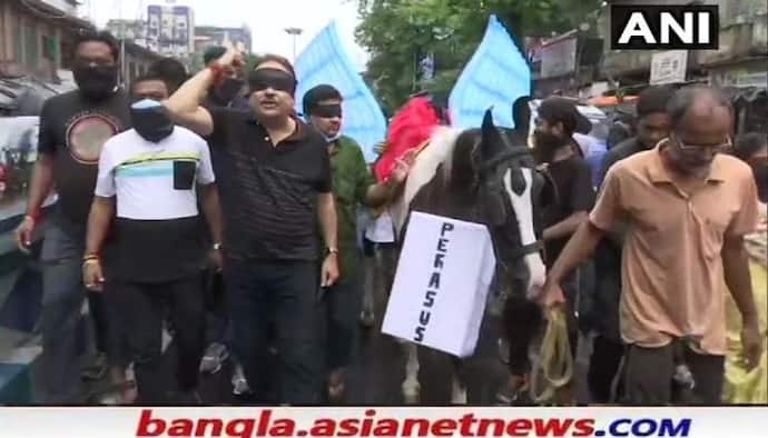 'পেগাসাসের বিষ ছড়াচ্ছে BJP', কালো কাপড় বেঁধে কালো ঘোড়ায় রাজপথে প্রতিবাদ মদনের