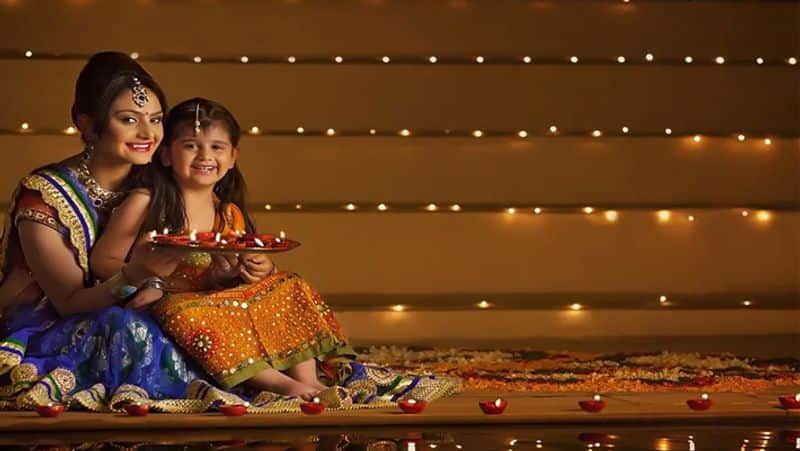 young indian lady holding diwali lamp on bokeh background generative AI  29642825 Stock Photo at Vecteezy