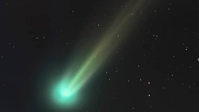 Green comet in the night sky 