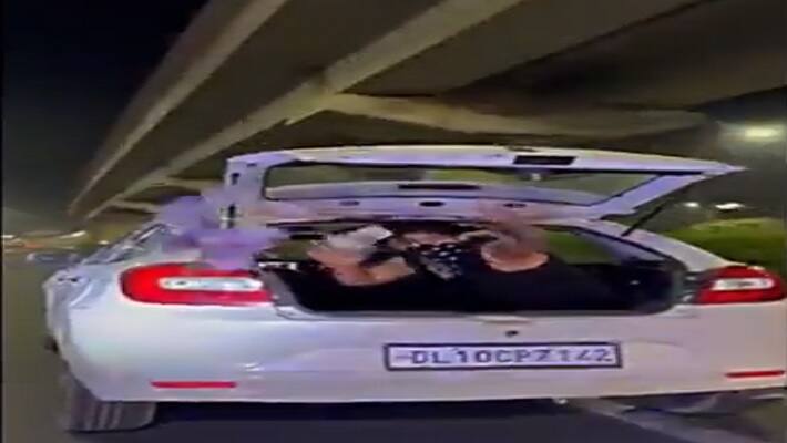 gurugram news, viral video, youtuber throwing money by car, arrested