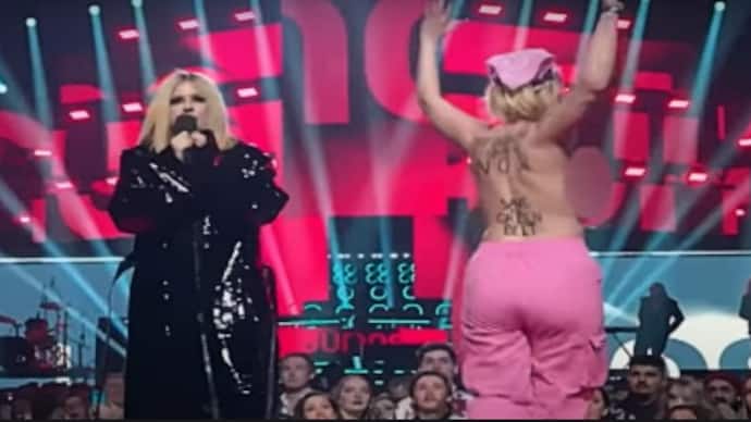 topless protester woman on juno award programme stage in Canada 