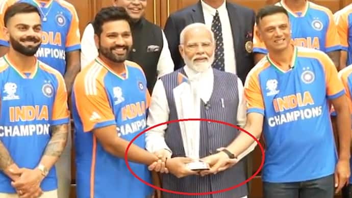 Narendra Modi hold Rohit Sharma hand
